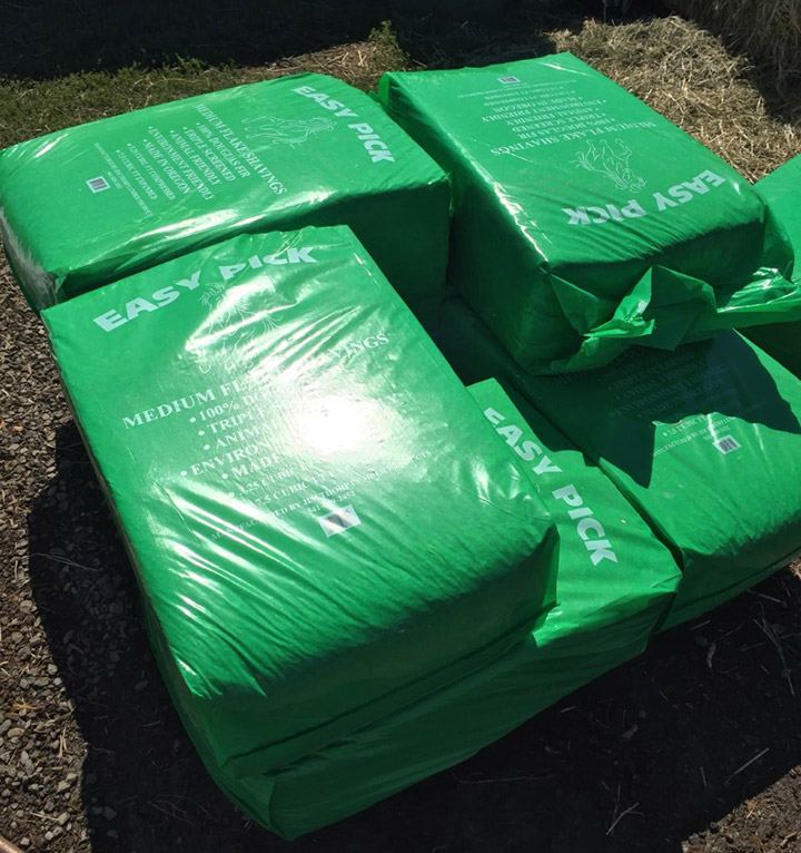 Stacked green Easy Pick Medium Flake bags